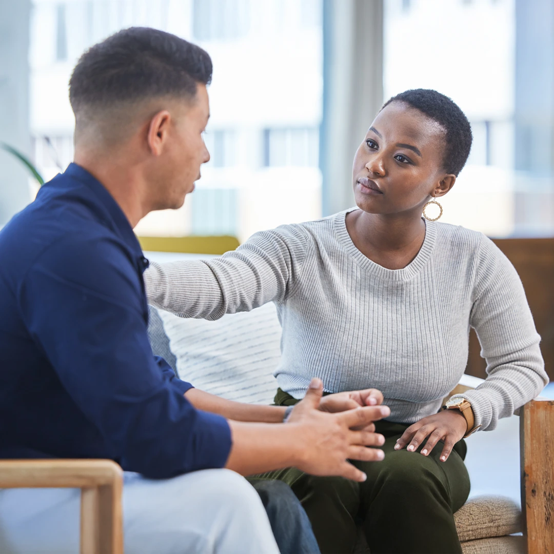 Mental-Heath-Care-Covered-by-Insurance-At-Changes-Healing-Center Supportive woman listening and comforting a man during a mental health counseling session, symbolizing care covered by insurance at Changes Healing Center in Arizona.