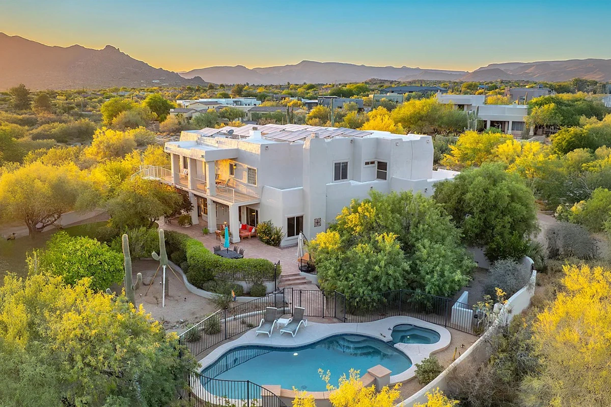 Aerial view of Changes Healing Center’s Scottsdale residential rehab facility with pool, desert landscaping, and mountain views at sunset.