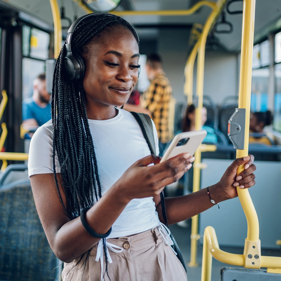 Mental-Heath-Care-Covered-by-Insurance-At-Changes-Healing-Center Young woman on a bus checking her phone—accessing mental health care covered by insurance.